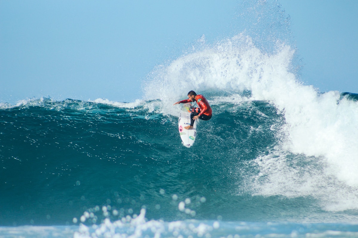 Surfer riding a wave at a Baja California beach break near Todos Santos