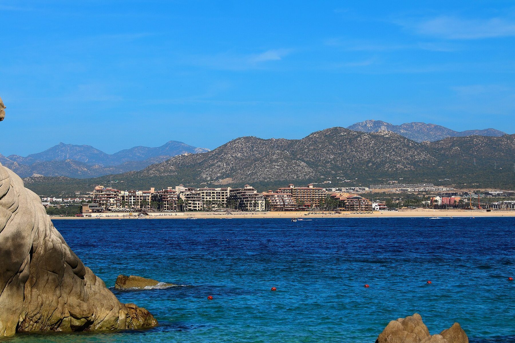 Beachfront dining on Medano Beach in Cabo San Lucas with toes in the sand