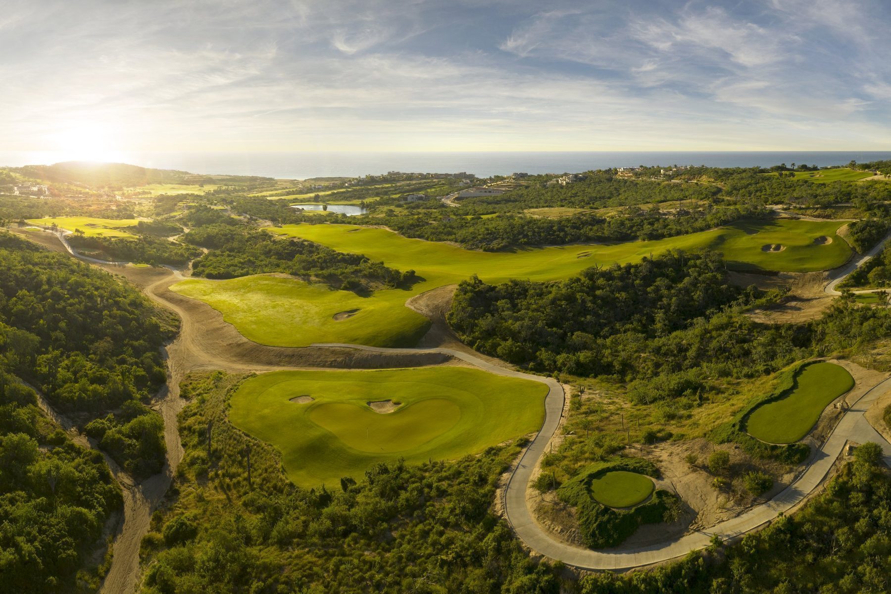 Championship golf course at Puerto Los Cabos with ocean views and desert landscape