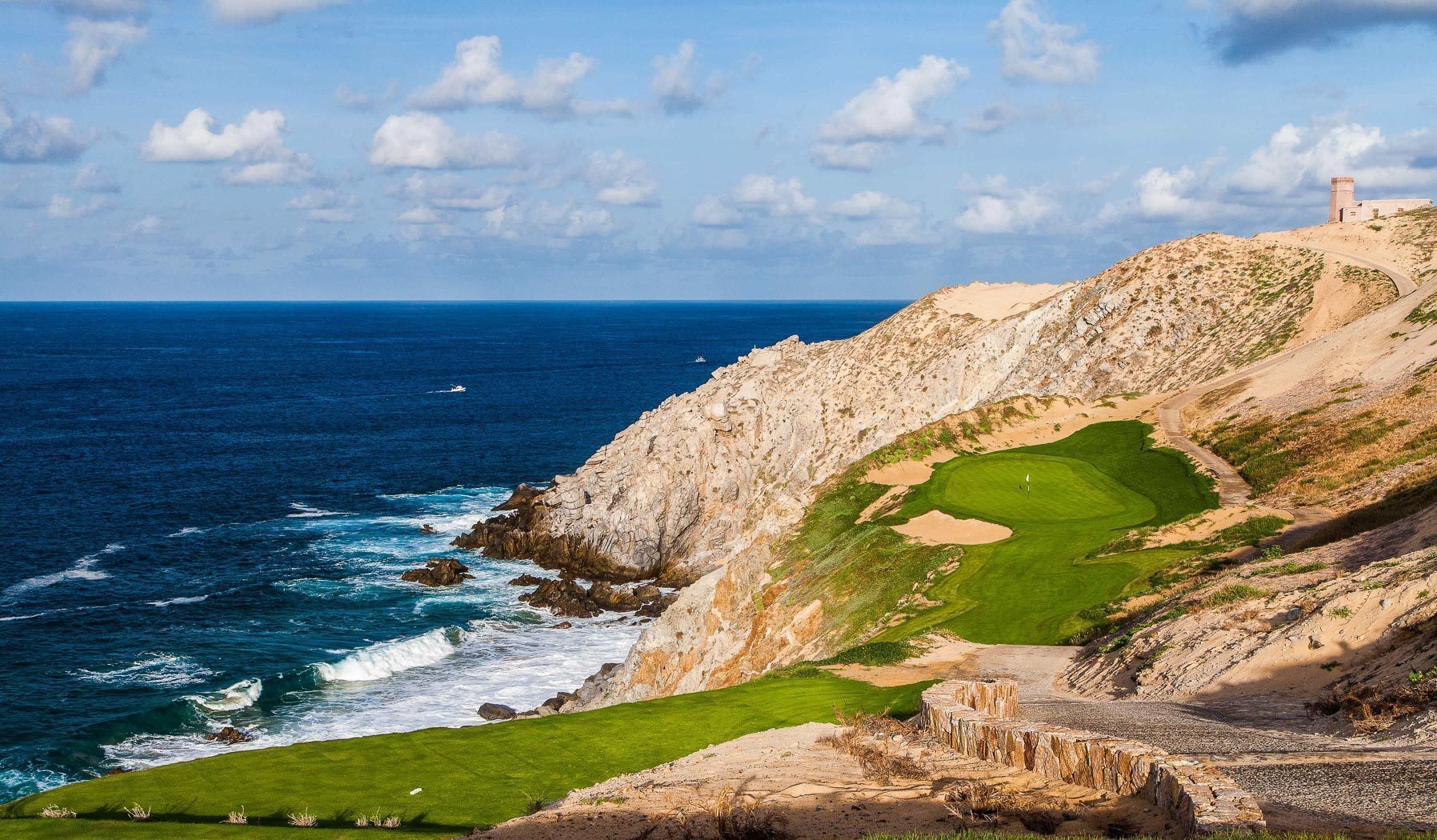 Pacific side of Cabo San Lucas Quivira coastline with dramatic granite cliffs and ocean
