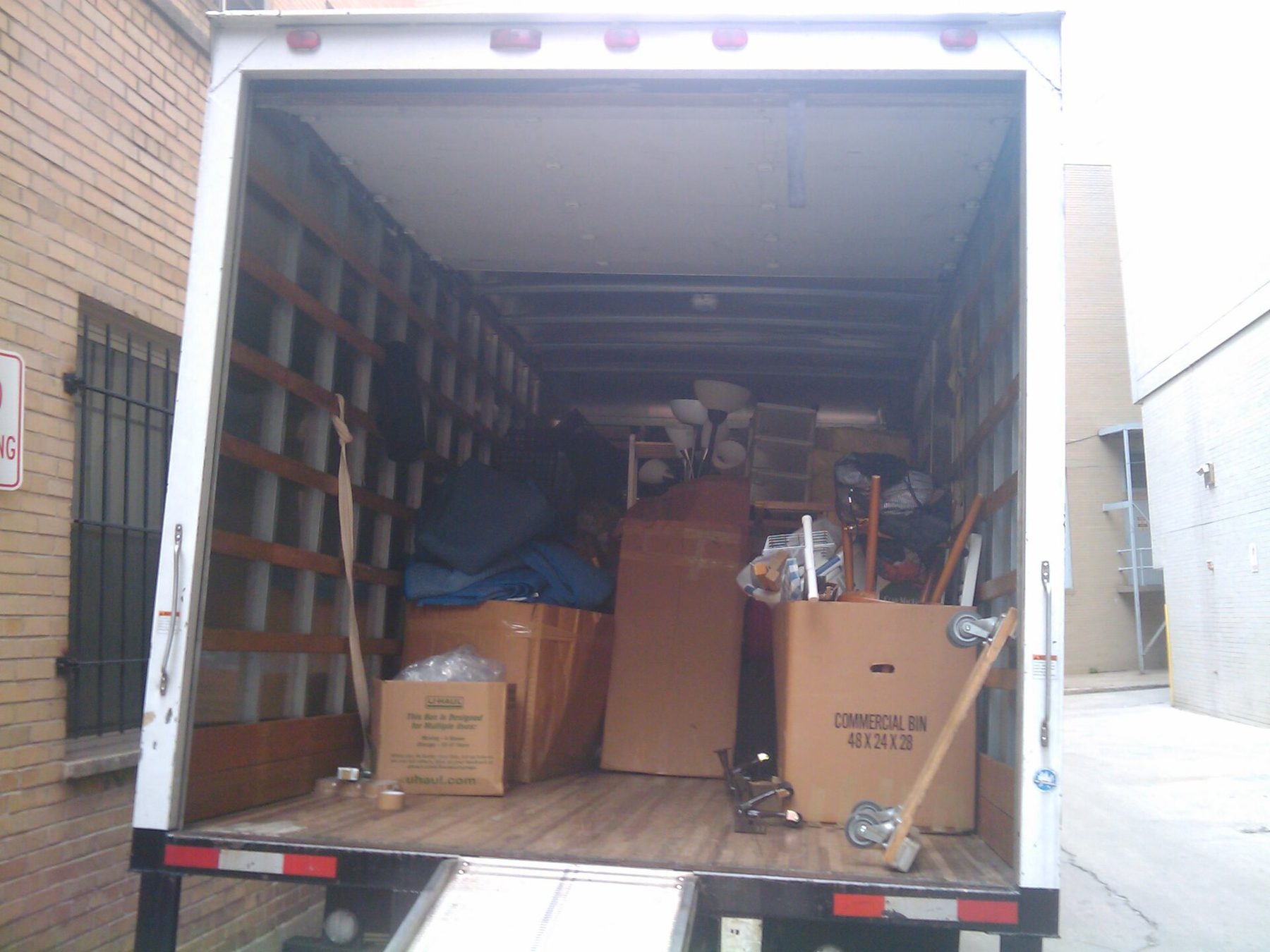 Cardboard moving cartons loaded in a moving truck