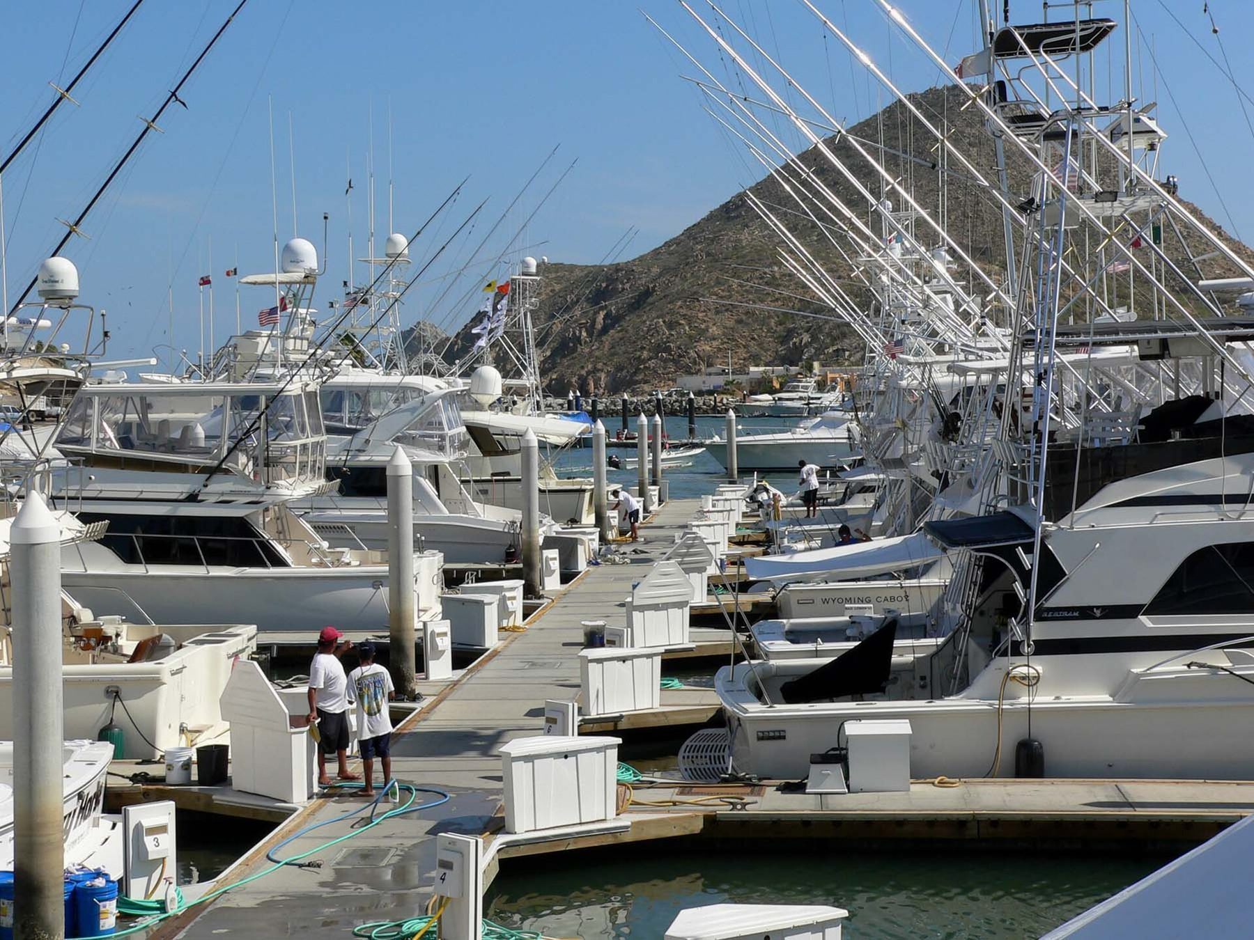 Charter fishing boat departing Cabo San Lucas marina for deep sea fishing