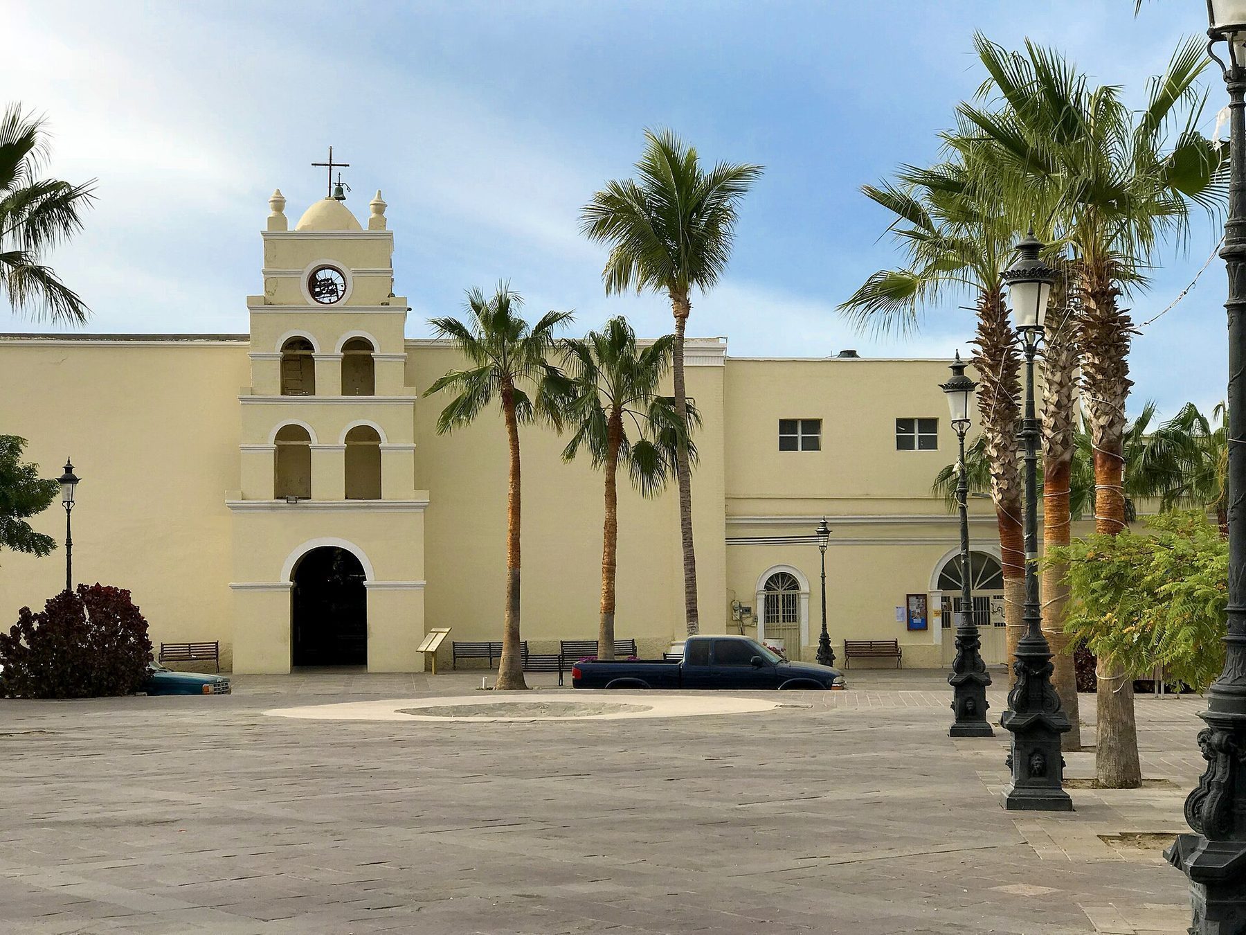 Colonial streets of Todos Santos with bougainvillea-draped walls and traditional architecture