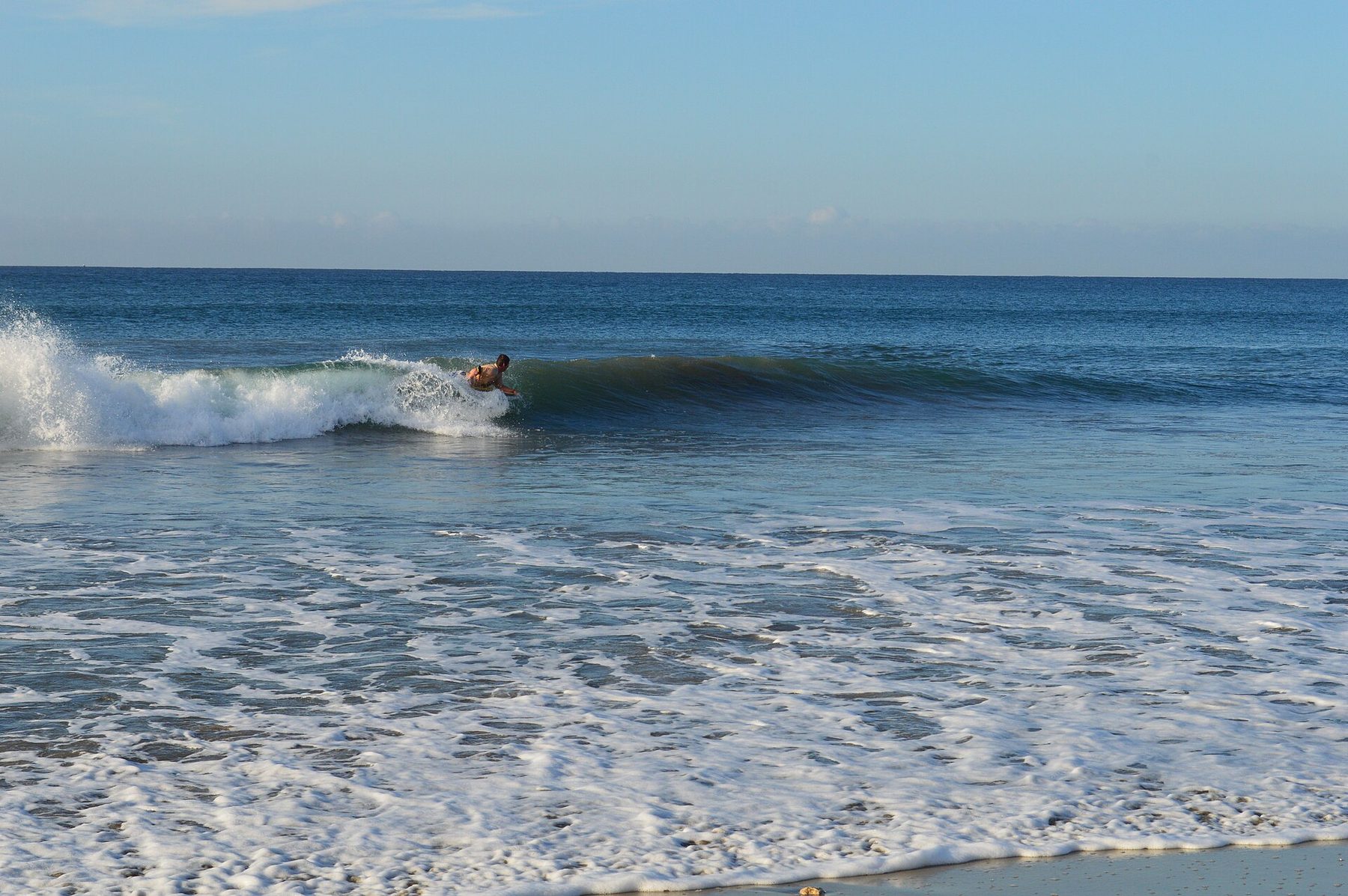 A bodyboarder riding a wave at San Jose del Cabo